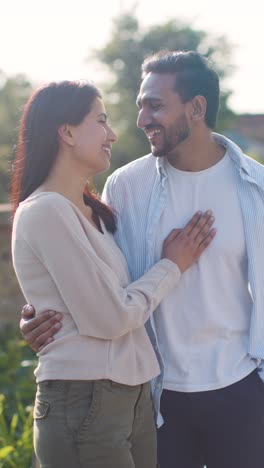 Vertical-Video-Of-Loving-Muslim-Couple-On-Date-Walking-Through-City-Park-Together-1